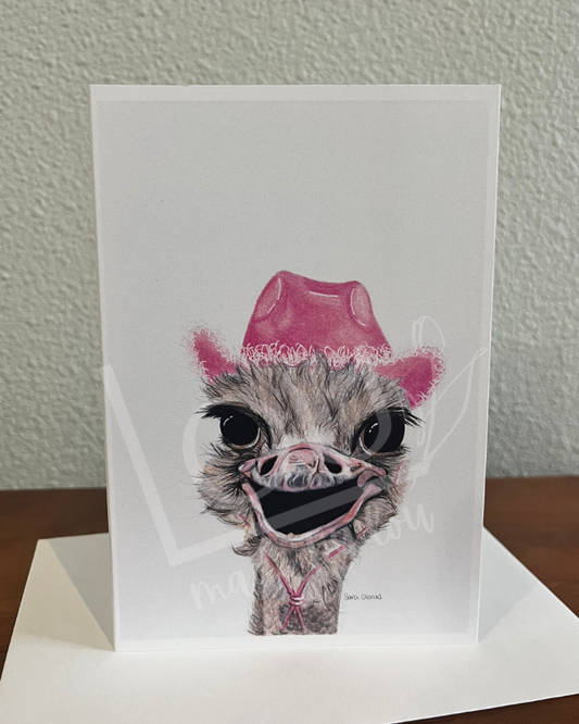 Ostrich wearing a pink cowboy hat