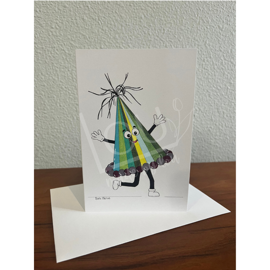 Greeting card with a colorful party hat design on a wooden surface.