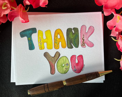 Colorful thank you card on black background